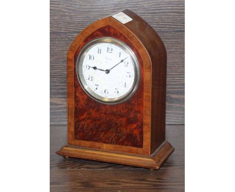 EARLY 20TH CENTURY MAHOGANY AND BURR WALNUT MANTLE CLOCK
with white enamel dial with Arabic numerals, marked French 8 day mov