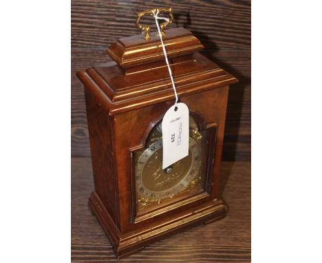 ELLIOTT OF LONDON MAHOGANY GILT FACED MANTEL CLOCK
with silvered Roman Numeral Chapter Ring and foliate motif dial, 240mm in 