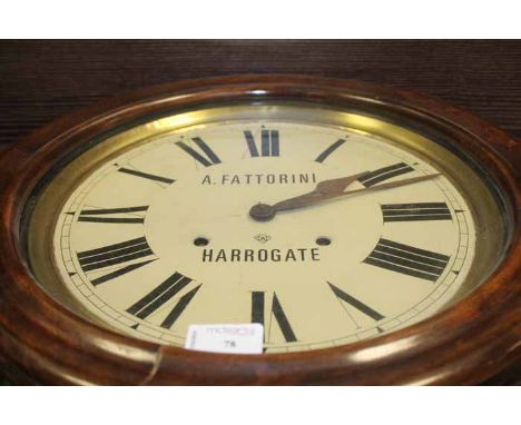 MAHOGANY WALL MOUNTED CLOCK
with large circular dial, and Roman numeral chapter ring, with pendulum and key, 63cm high