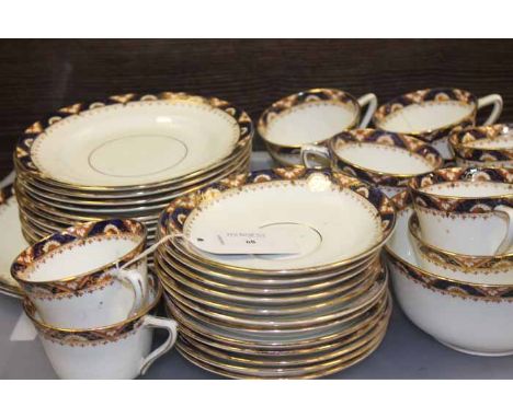 EARLY 20TH CENTURY TEA SET
with brown and blue border with gilt edge, twelve cups, saucers, side plates, slops bowl, and two 