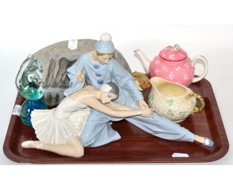 A Lladro figure group of a clown and ballet dancer, a Royal Worcester teapot, a Belleek cream jug, a Mdina glass paperweight,