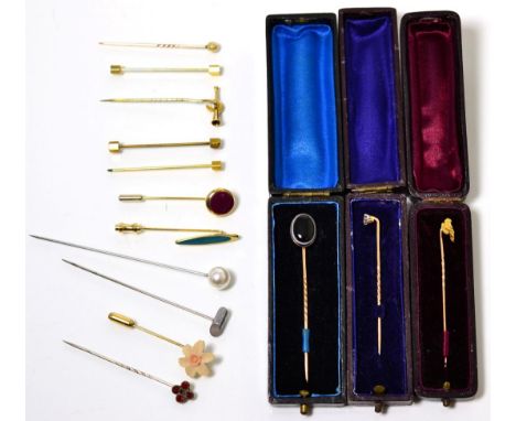 An old cut diamond stick pin, estimated diamond weight 0.25 carat approximately; a banded agate stick pin, a gold nugget stic