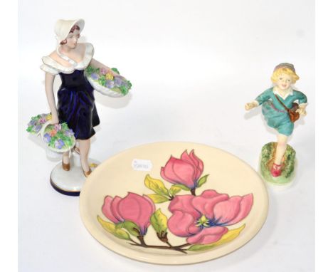 Royal Worcester figure ''Thursday's Child Has Far To Go'', a Royal Dux figural as a flower seller and a Moorcroft pottery pla