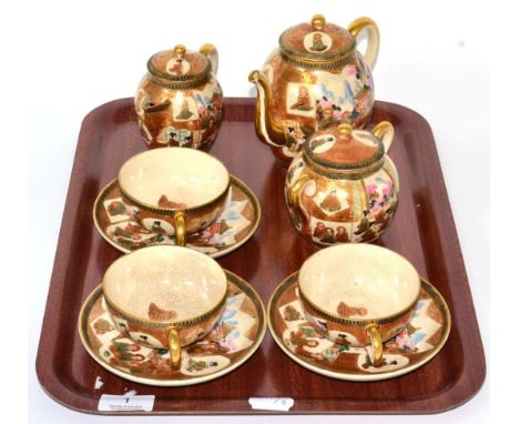 A Japanese Satsuma pottery part tea service, decorated with seated women and monks in an interior, signed to base 