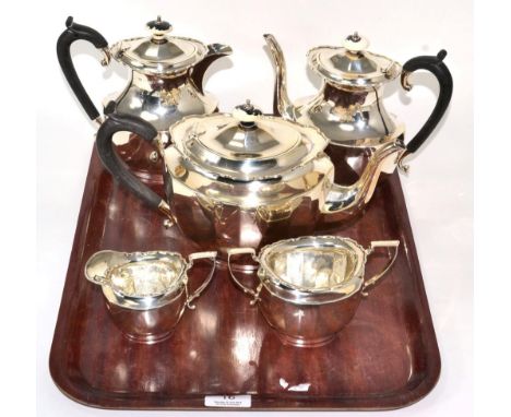 A silver five piece tea and coffee service, William Devenport, Birmingham 1924, oval panelled form with shaped rim, the hinge