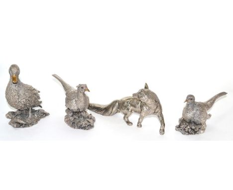 A pair of Country Artists filled silver pheasant models, a Country Artists filled silver model of a duck and a white metal mo