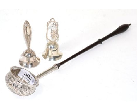 An 18th century silver toddy ladle, unmarked, profusely chased with C scrolls, flowers and scales, together with two panels o