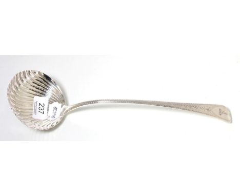 A George III silver ladle with shell form bowl and bright cut decoration, London 17904.6ozt