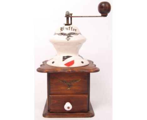 A 20th century Swastika decorated 'Kaffee' (Coffee) grinder on wooden base with sliding draw. 'Eigentum der Luftwaffe' stampe