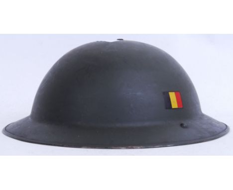 An original post Second World War WWII Belgium green tin helmet with Belgian flag to side. With original liner. 