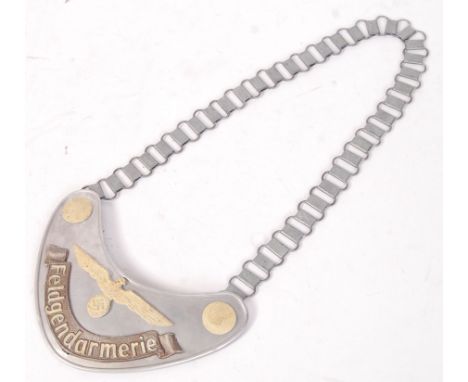 A reproduction German Third Reich Nazi WWII Second World War uniform Gorget from the Feldgendarmerie division. With chain and
