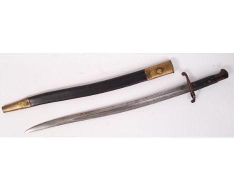 An early 20th century French Chassepot rifle bayonet. With scabbard and curved blade. Markings to recasse. 71cm long.   