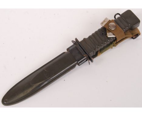 An original M8A1 USA military combat dagger. Blade marked for Japan. Complete with scabbard. 32cm long. 