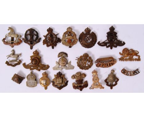 A collection of 20x assorted original WWI (mostly) First World War cap badges. To include; The King's Own, Army Cyclist Corp,