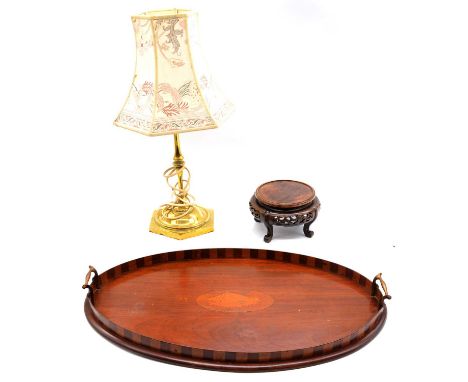 Two inlaid Edwardian mahogany galleried trays, one of oval form, the other of waisted form; a brass table lamp; and a Chinese