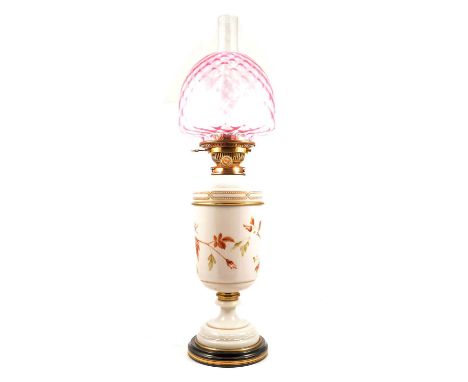 Victorian opaque glass and brass-mounted oil lamp, painted decoration, ruby tinted shade, complete with chimney, 68cm.Conditi