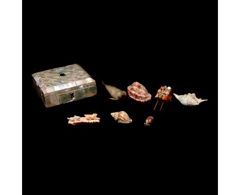 Mother-of-pearl box, gaming tokens, silver and mother-of-pearl teether, small seal, shells, etc.