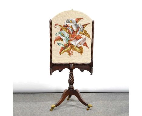 William IV mahogany pole screen, arched needlework panel, gadrooned frame, turned wrythen column, tripod legs with brass paw 