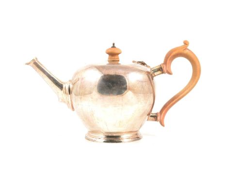 Silver teapot, Goldsmiths &amp; Silversmiths Co., London 1934, spherical with straight spout, wooden handle and finial, 16cm,