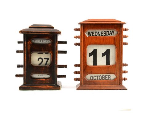 Oak cased desk top perpetual calendar, architectural top and plinth base, 27x19cm, working and another similar beeahc cased c