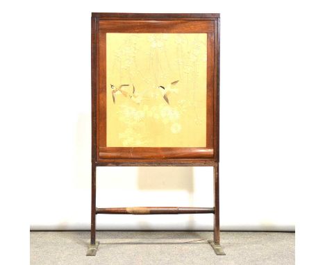 Edwardian mahogany firescreen, with Japanese silk panel of birds amongst leaves, width 65cm, height 118cm.