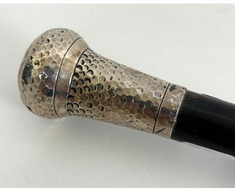 A walking stick, with a silver coloured metal handle, 62 cm wide 