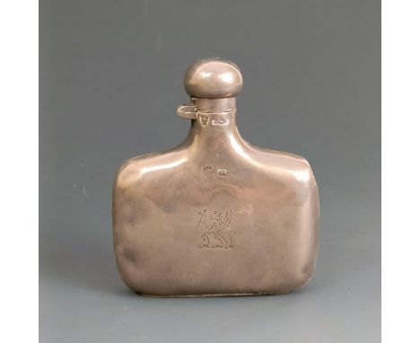 A silver flask, crested, Sheffield 1923, 9.5 cm high, 2.3 ozt 
