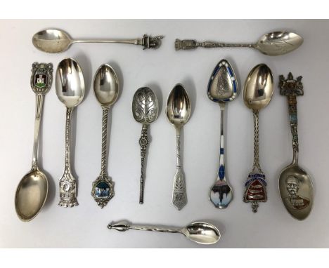 Assorted silver coloured metal and other travel/commemorative spoons, some with enamel decoration10 ozt 
