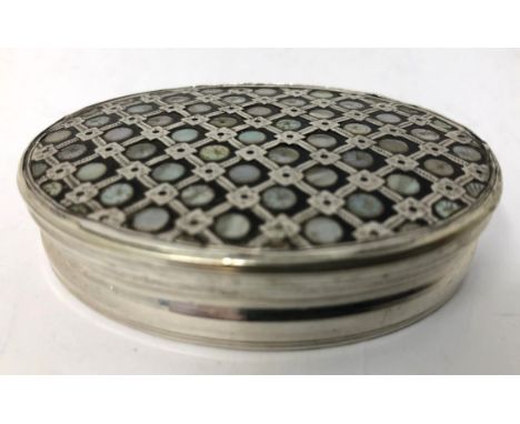 A late 18th/early 19th century silver coloured metal, tortoiseshell and mother of pearl inlaid oval snuff box, apparently unm