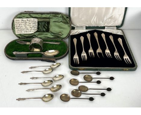 A set of six Art Deco silver cake forks, cased, a fork, spoon and napkin ring, cased, a set of six Apostle spoons, and a set 