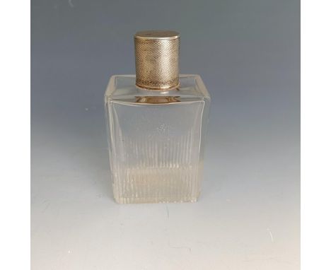 A glass and silver mounted scent bottle, with engine turned decoration, London 1938, 10 cm high 