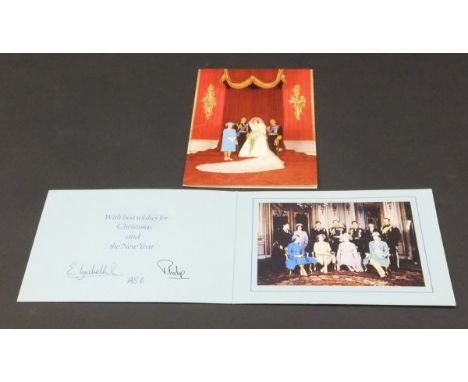 A Christmas card from Her Majesty The Queen and Prince Philip depicting The Queen and Prince Philip with Prince Charles and P