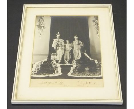 A framed and glazed photographic image of George VI and Queen Elizabeth with Princesses Elizabeth and Margaret by Dorothy Wil