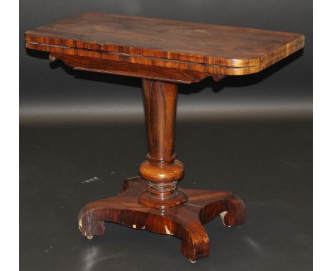 An early Victorian rosewood card table, the rectangular foldover top opening to reveal a circular baize on pedestal quatrefoi