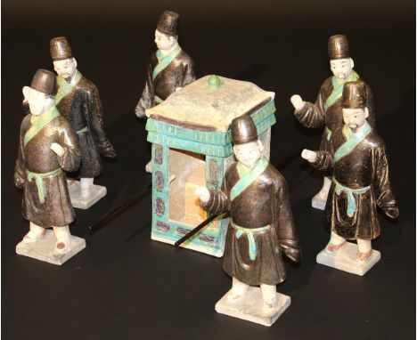 A Ming Dynasty glazed pottery sedan chair group, polychrome decorated in dark ochre and turquoise, comprising sedan chair and