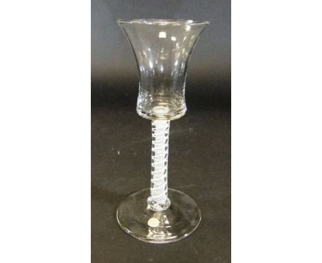 A mid 18th Century wine glass with waisted bucket shaped bowl to stem with double series opaque white twist - an opaque gauze