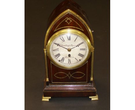 A 19th Century mahogany and brass inlaid mantel clock of lancet form, the movement with circular silvered dial inscribed "Han
