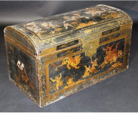 An 18th Century black ground Chinoiserie decorated dome top trunk decorated with dragons and warriors, 112 cm wide CONDITION 