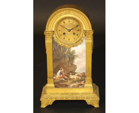 A 19th Century French gilt metal cased mantel clock in the Louis XVI taste, the domed top with egg and dart and laurel wreath
