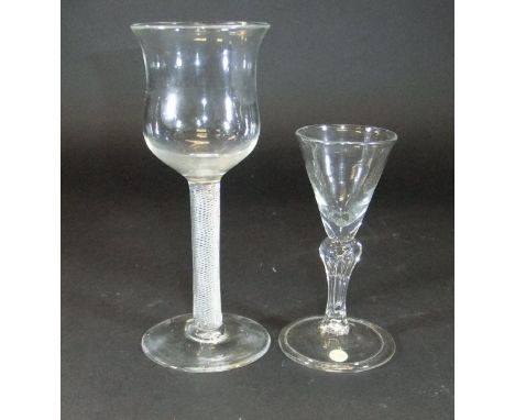 A mid 18th Century goblet with a tall waisted cup shaped bowl and multiple spiral air twist stem to plain foot, 16 cm high, a