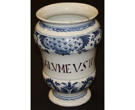 An 18th Century Italian majolica albarello, painted in blue with foliate decoration and inscribed "ALVME. VSTO" to the side, 