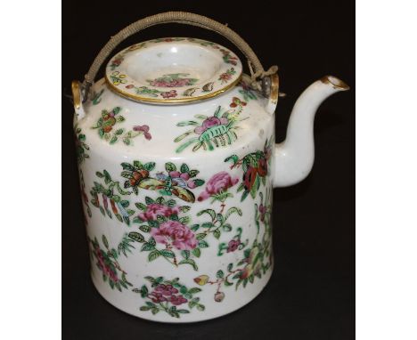 A Chinese porcelain cylindrical teapot decorated in the famille-rose palette with flowering branches and butterflies and with