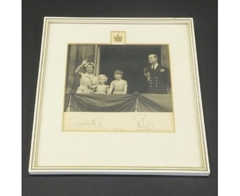 A framed and glazed black and white image of Her Majesty The Queen and Prince Philip with Prince Charles and Princess Anne on