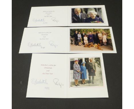 A Christmas card from Her Majesty The Queen and Prince Philip depicting twelve members of the Royal Family and five dogs, 199