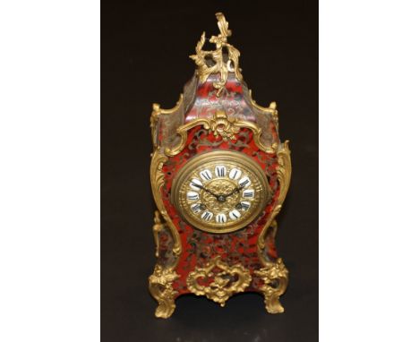 A late 19th Century boulle work decorated mantel clock in the Rococo taste of Louis XV with all-over gilt metal embellishment