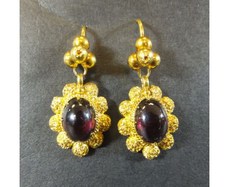 A pair of gold and garnet set cluster style earrings CONDITION REPORTS Has some light general wear and some slight scratching