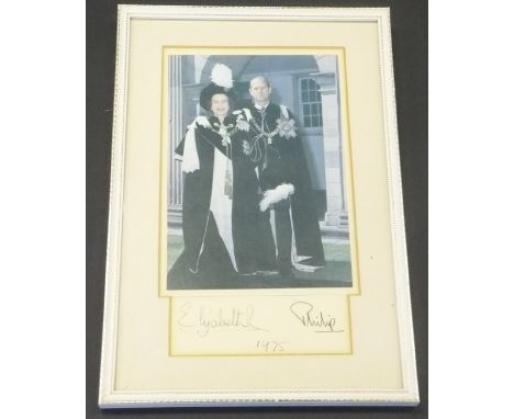 A framed and glazed image of Her Majesty The Queen and Prince Philip in Garter Robes adapted from the 1975 Christmas card sig