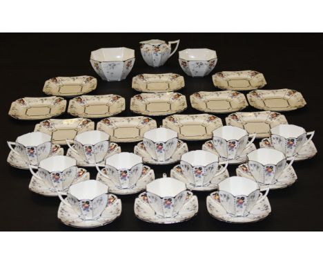 A Shelley "Queen Anne" pattern tea service for twelve place settings, each decorated with peaches and grapes, Registered No. 