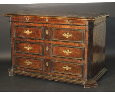 A late 17th / early 18th Century Italian burr walnut and boxwood strung commode, the top with moulded edge over four drawers 