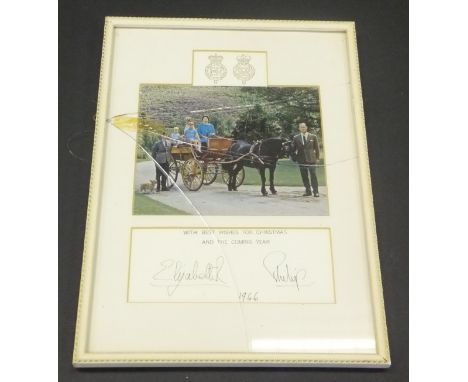 A framed and glazed image of Her Majesty The Queen with children in pony and trap, Prince Charles holding the pony adapted fr